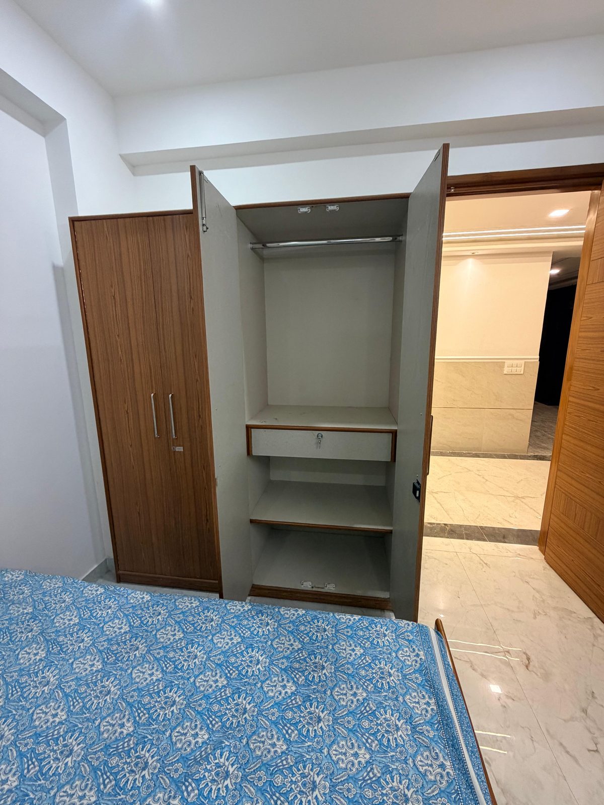 Spacious wardrobe with lockable drawer at Tri-Homes L-10